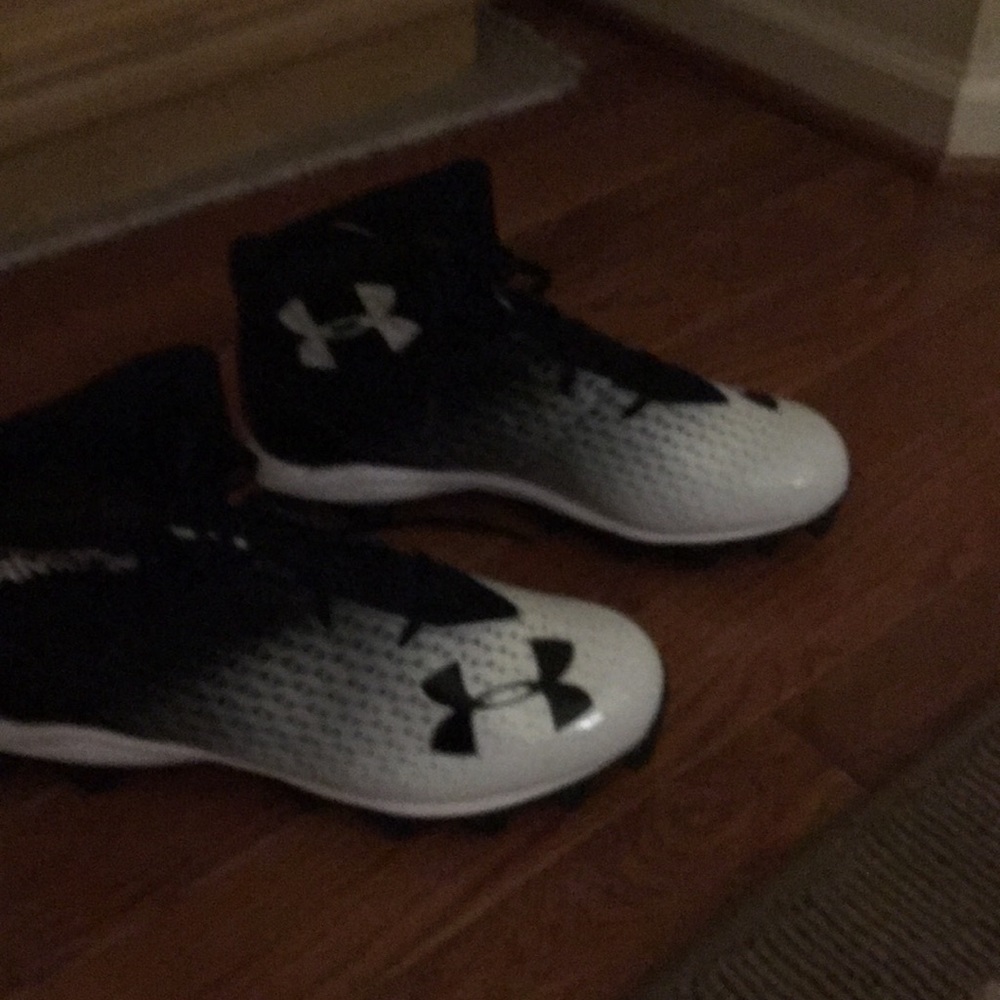 Under armor never worn cleats. Size 12